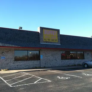 a car parked in front of the restaurant