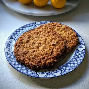 Anzac biscuits. To give you a sense of size, the plate is 8-inches in diameter.