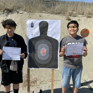 Some teen taking in the knowledge and displaying smiles on a job well done.