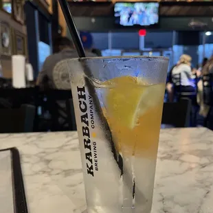 Water with fresh lemon and solid heavy glass