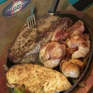 Victor&apos;s Special, Rib-eye, shrimp wrapped with bacon and Grilled chicken breast served with rice and beans and flour tortillas