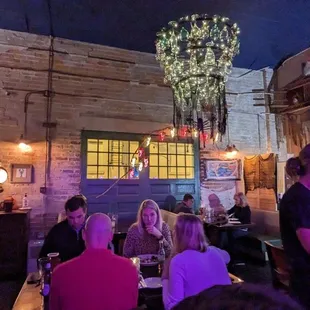 eople sitting at tables in a restaurant