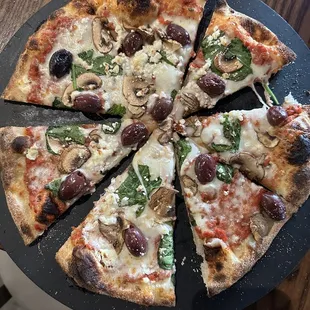 Created: goat cheese, mushrooms, Kalamata, olives, spinach pizza! Really  tasty!