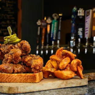 a pile of fried food on a cutting board