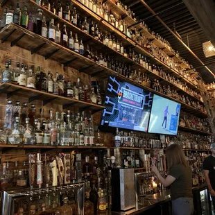 a bar filled with liquor bottles