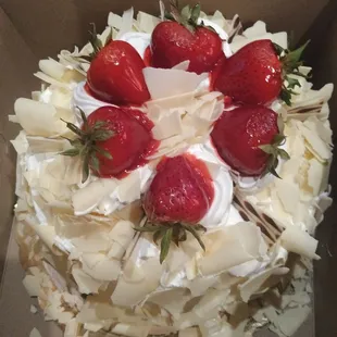 Beautiful cake with strawberry and cream filling.