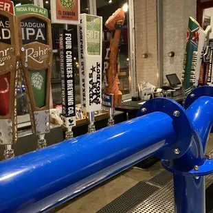 a row of beer taps