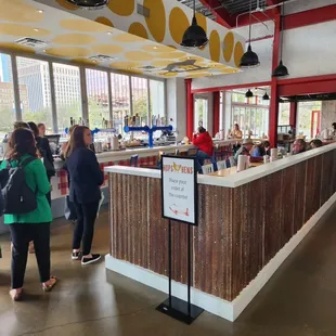 people standing in line at the counter