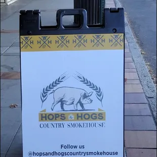 A sign was placed on the sidewalk in front of the restaurant to draw attention.