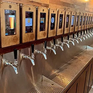 a row of beer taps