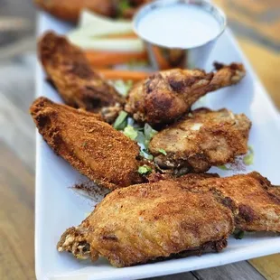 Wings, 2 flavors: Buffalo &amp; HT Dry Rub. Order extra crispy.