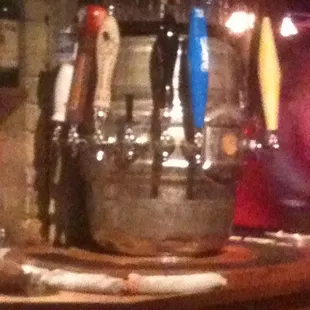 a row of beer taps in a bar
