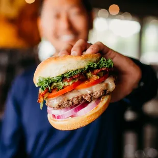 a man holding a sandwich