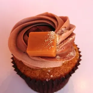 a cupcake with chocolate frosting and caramel