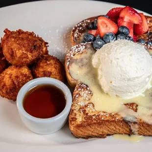Brunch like a boss with our French Toast: buttery brioche, savory pudding glaze, fresh berries, and whipped cream.
