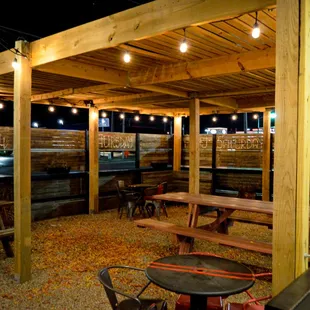 an outdoor seating area at night