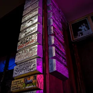 a stack of books with neon lights