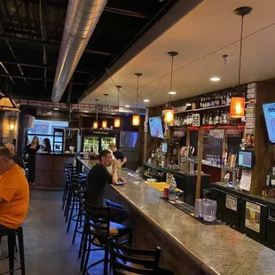 people sitting at the bar