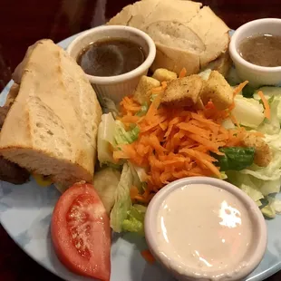 French Dip sandwich with salad.