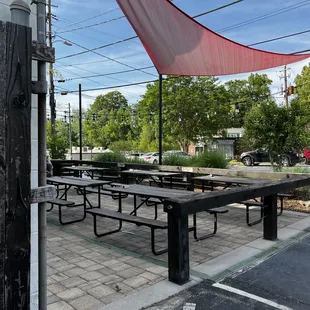 The outdoor patio is in front of the restaurant.