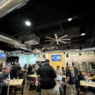a large group of people at tables