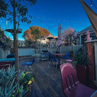 a patio with tables and chairs