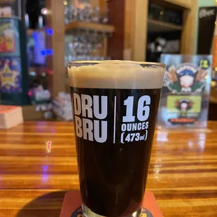 a pint of beer on a table