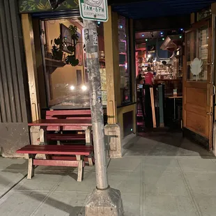 a bench and a street sign