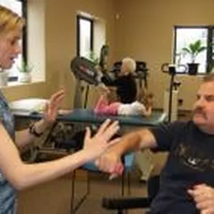 Mandy is working with a patient to improve hand - eye coordination.