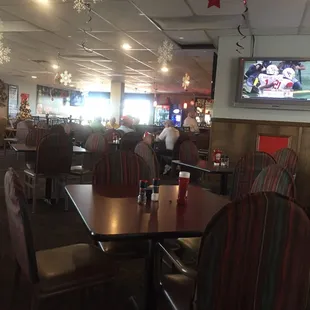 people sitting at tables in a restaurant