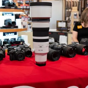 Canon cameras and lenses during a Canon demo at the Trade-In Trade-Up event. Featured Canon RF 100-300mm lens