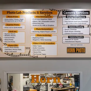 Photo Lab: prints, photo gifts, film dev, photo restoration, digitizing photos and videos. 
Camera Services: camera repair &amp; used cameras