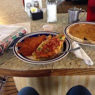 Okie omlet with one pancake and hash brown.   It was amazing !