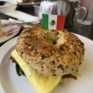 Everything bagel egg,cheese,spinach,tomatoes and bacon