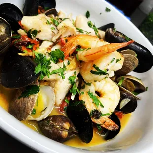 a bowl of seafood and clams