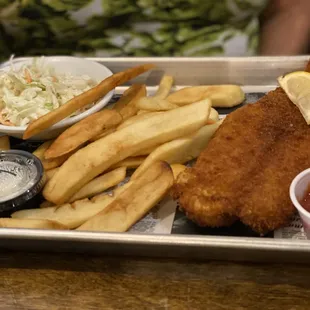 Fish n chips. Potato wedges and cole slaw. Tasty dish