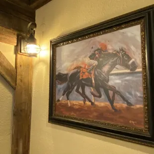a painting of a horse and rider