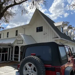 a jeep parked in front of the building