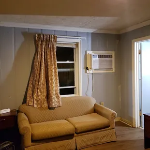 no heat in this room either.  blinds fell off window when opening it to try to clear the cigarette smoke.  Bare lightbulb on ceiling