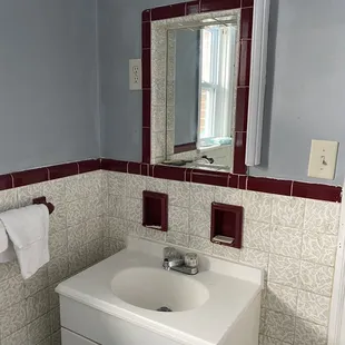 World&apos;s tiniest bathroom mirror? Broken soap trays.