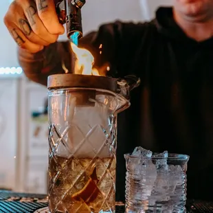 a bartender making a drink