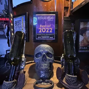 two wine bottles and a skull