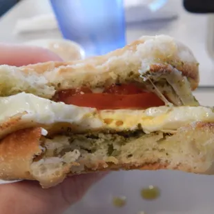 Gooey cheese on the pesto egg sandwich.