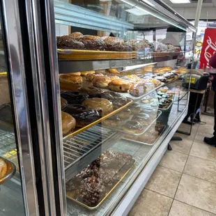 a display case filled with donuts