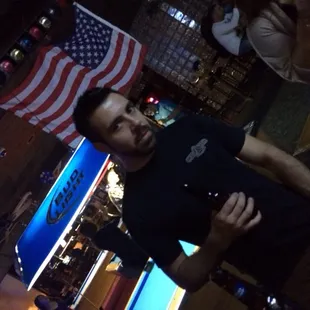 a man standing in a bar
