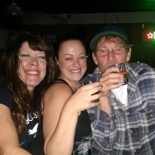 a group of people sitting at a bar