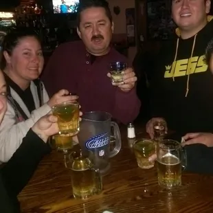 a group of people drinking beer
