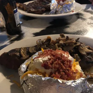 Ribeye well and Sirloin prime with grilled mushrooms....EAT UP!!!!