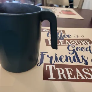 a cup of coffee on a table