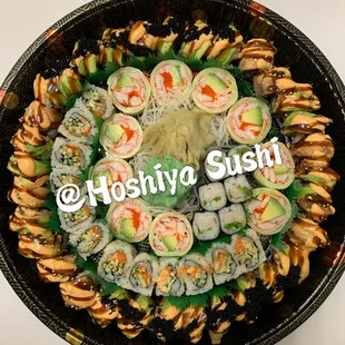 a plate of sushi rolls